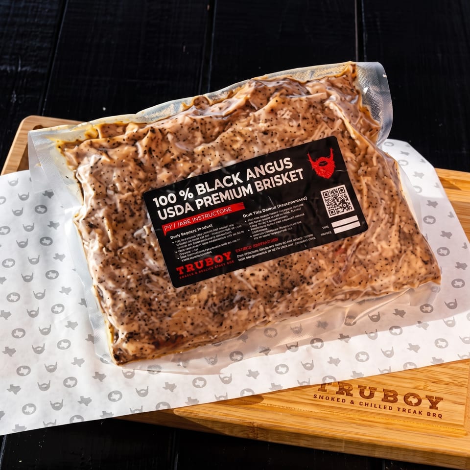 Vacuum-sealed Black Angus premium brisket package on branded TruBoy butcher paper and wooden serving board.